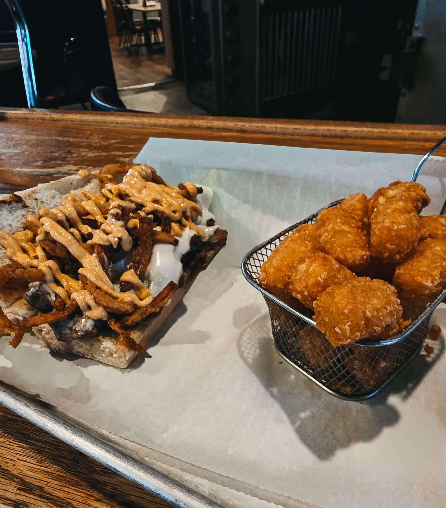 The Vault sandwich with tots