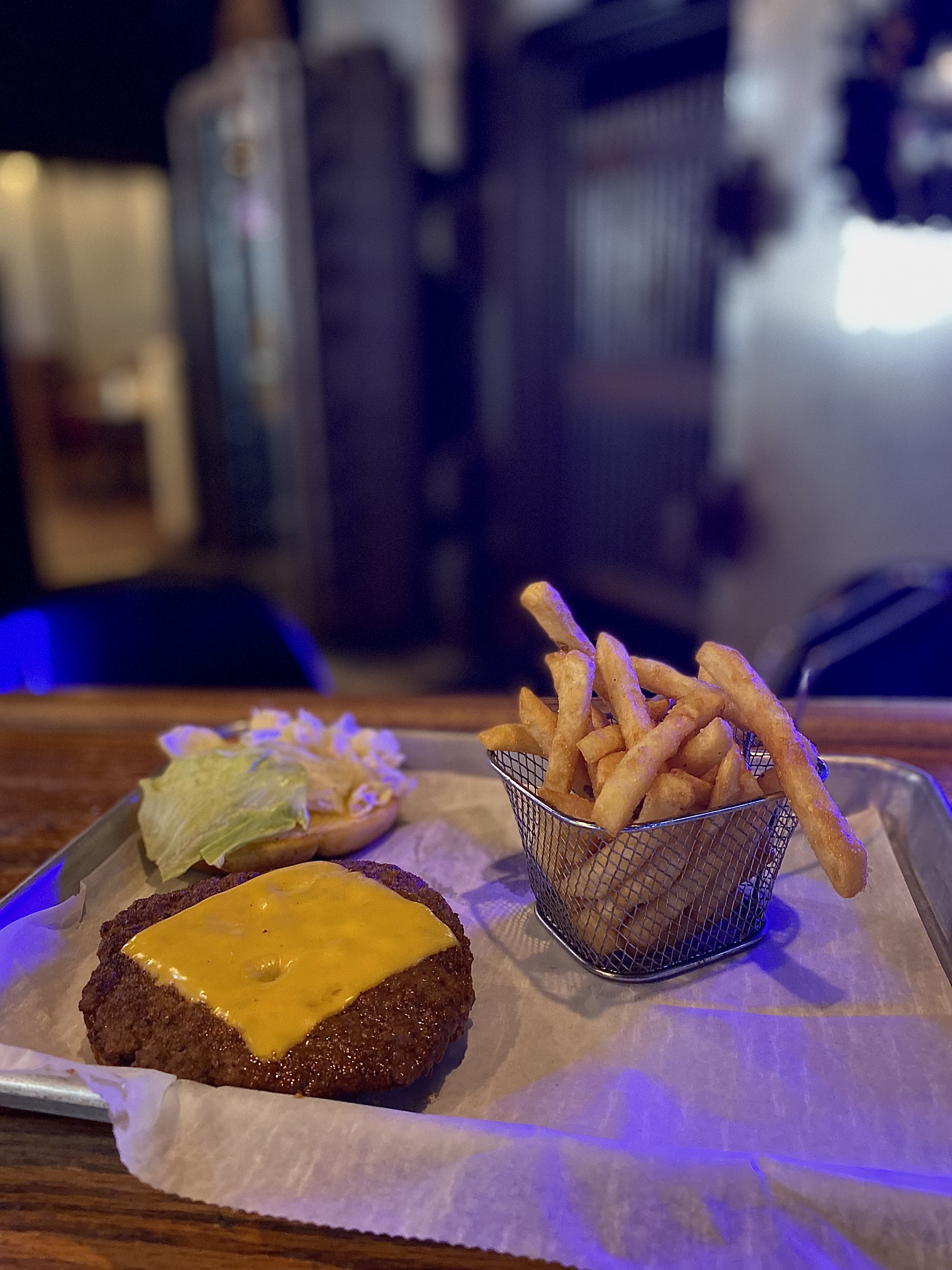 Cheeseburger with fries at The Vault